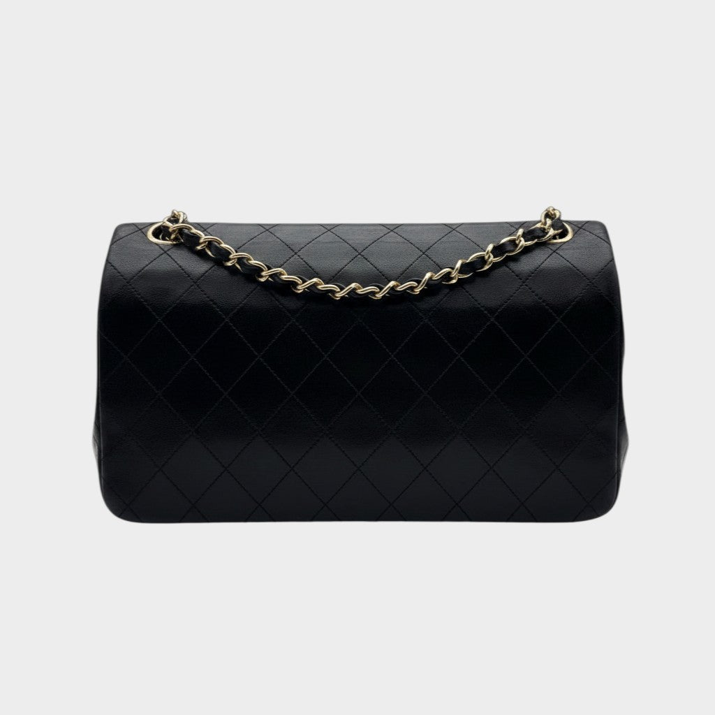 CHANEL shoulder bag features a Matelasse design, a turnlock pattern, a Coco mark, black chain shoulder bag, gold hardware, and leather.