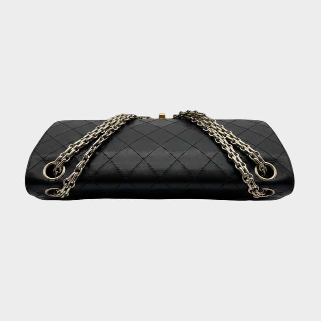 CHANEL shoulder bag features a Matelasse design, a turnlock pattern, a Coco mark, black chain shoulder bag, gold hardware, and leather.