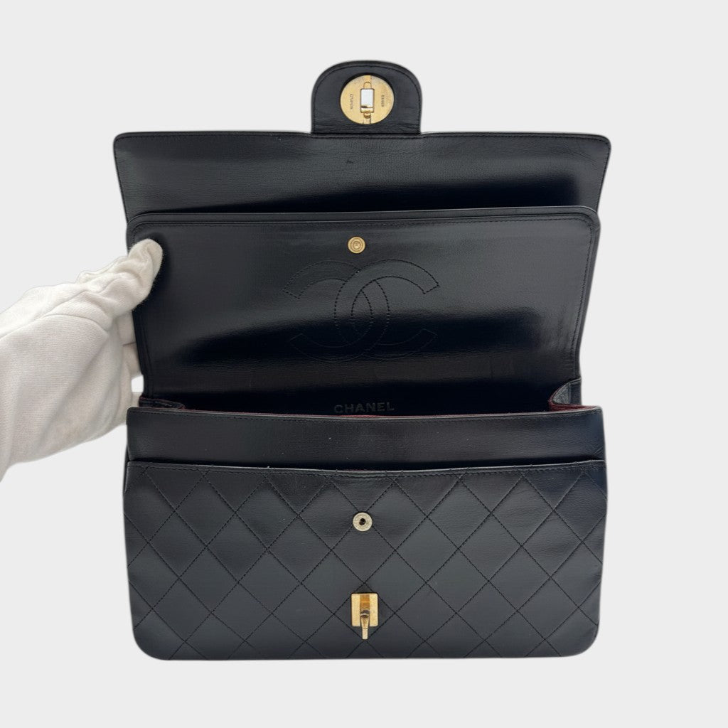 CHANEL shoulder bag features a Matelasse design, a turnlock pattern, a Coco mark, black chain shoulder bag, gold hardware, and leather.